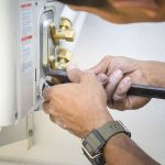 HVAC-professional-fixing-HVAC-system-1