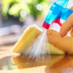 cleaning-with-spray-detergent-rubber-gloves-and-dish-cloth-on-work-picture-id1202033073